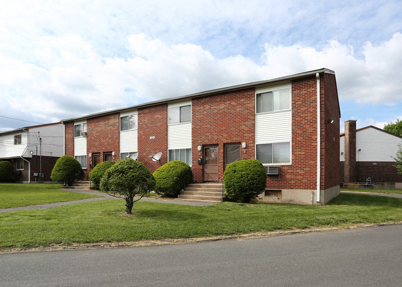 an apartment building on the side of a street
