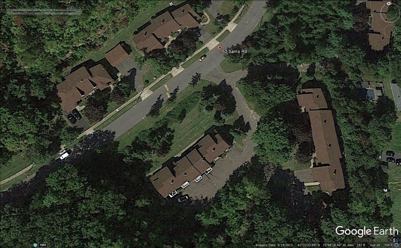 a google earth view of a neighborhood with houses and trees