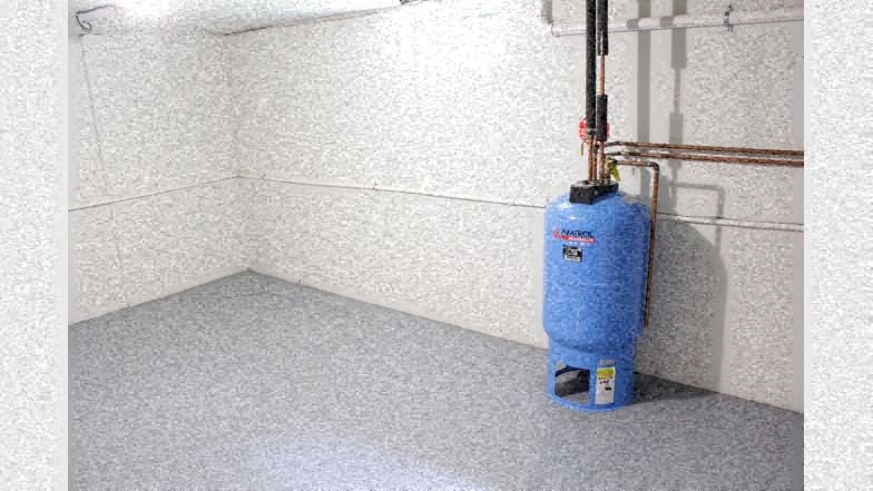 a blue extinguisher in the corner of a room