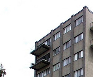 a building with a red car parked in front of it