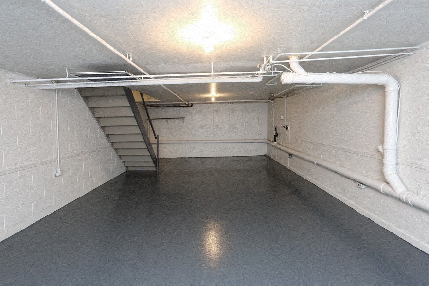 the inside of a parking garage with stairs