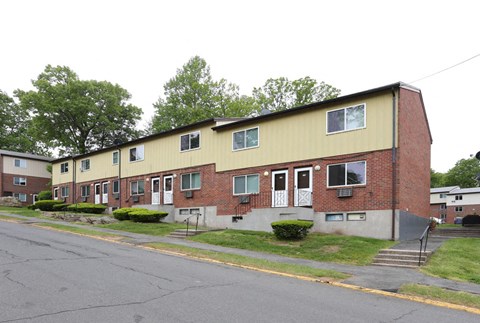an apartment building on the corner of a street