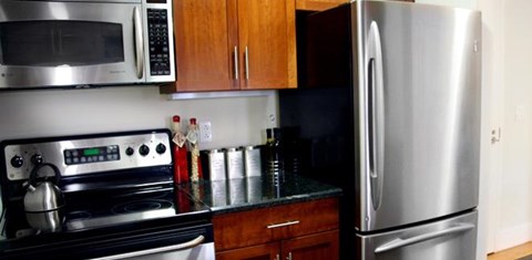 a kitchen with a stove and a refrigerator
