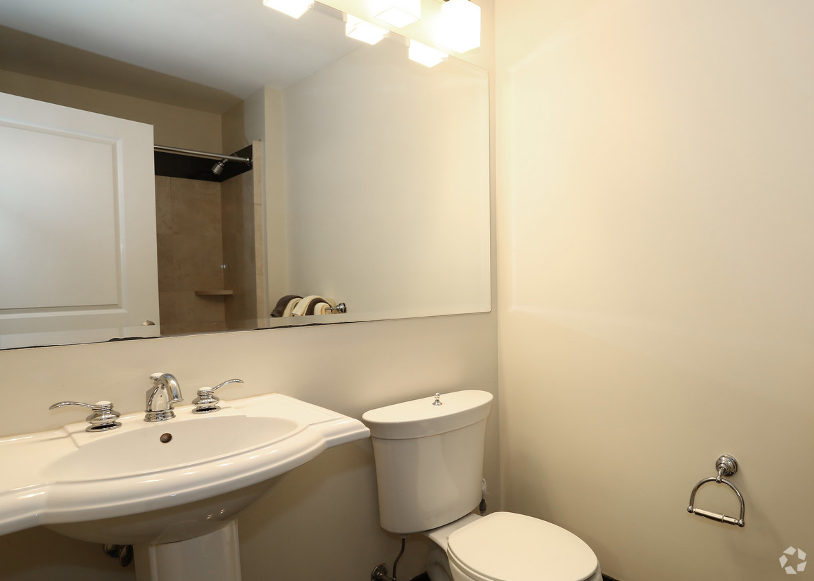 a small bathroom with a sink toilet and mirror