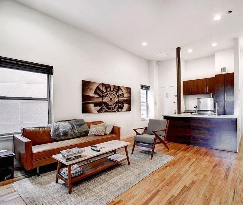 a living room with a couch and a table