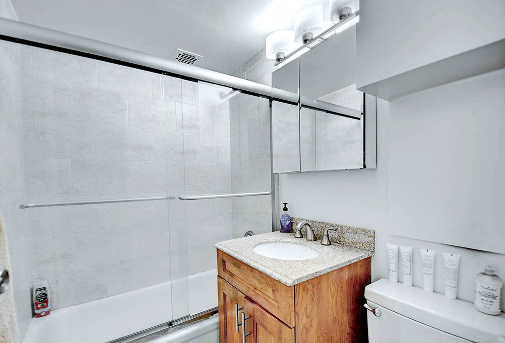 a bathroom with a sink and a shower