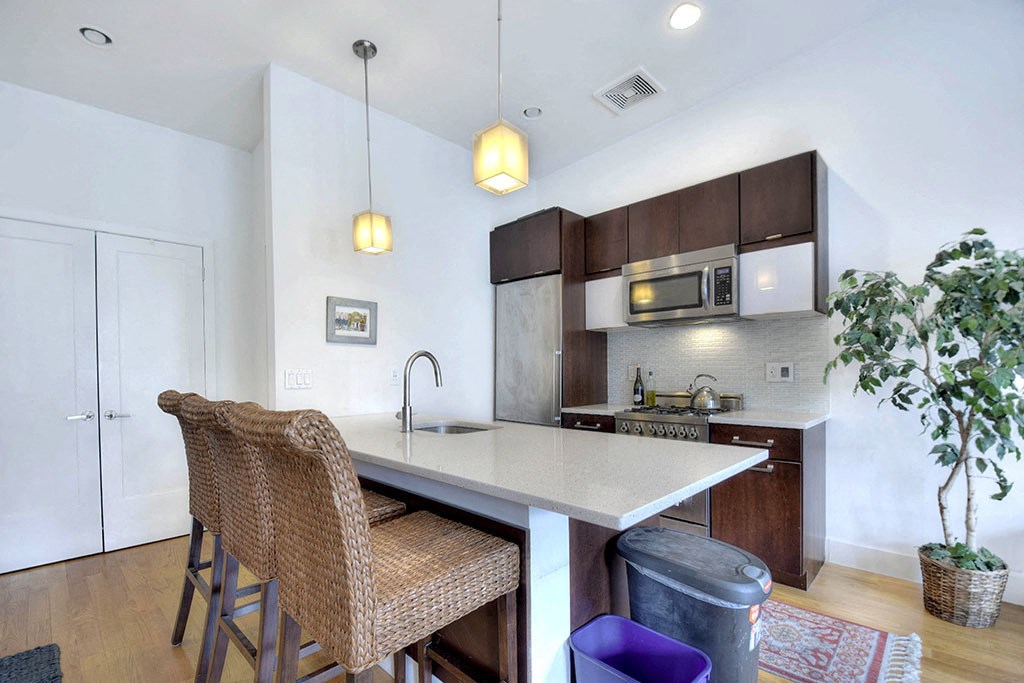 a kitchen with a island and a counter top