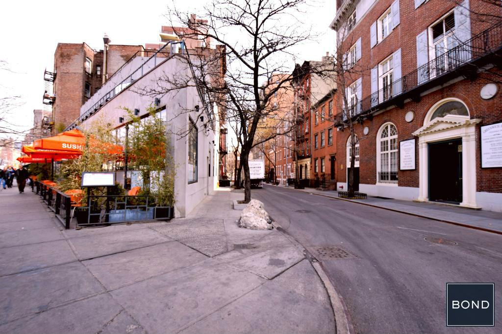 a street view of a city street with buildings