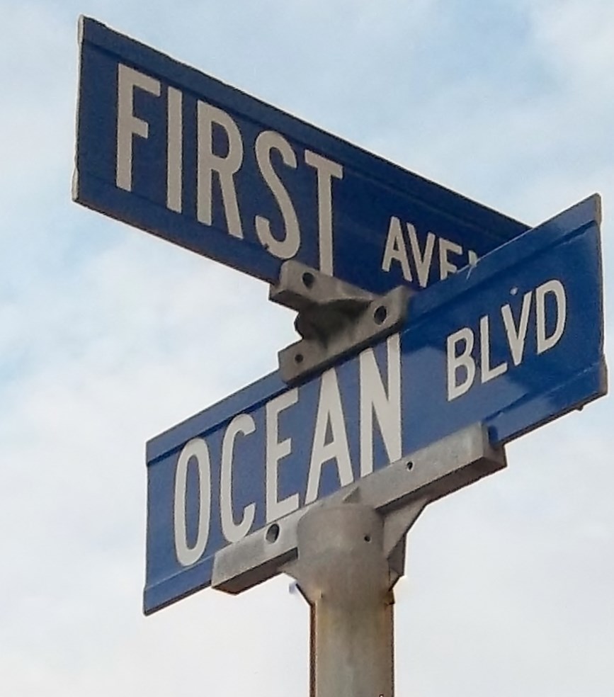 a street sign for first ave and ocean blvd