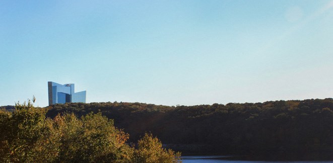 a view of a river and a skyscraper in the distance