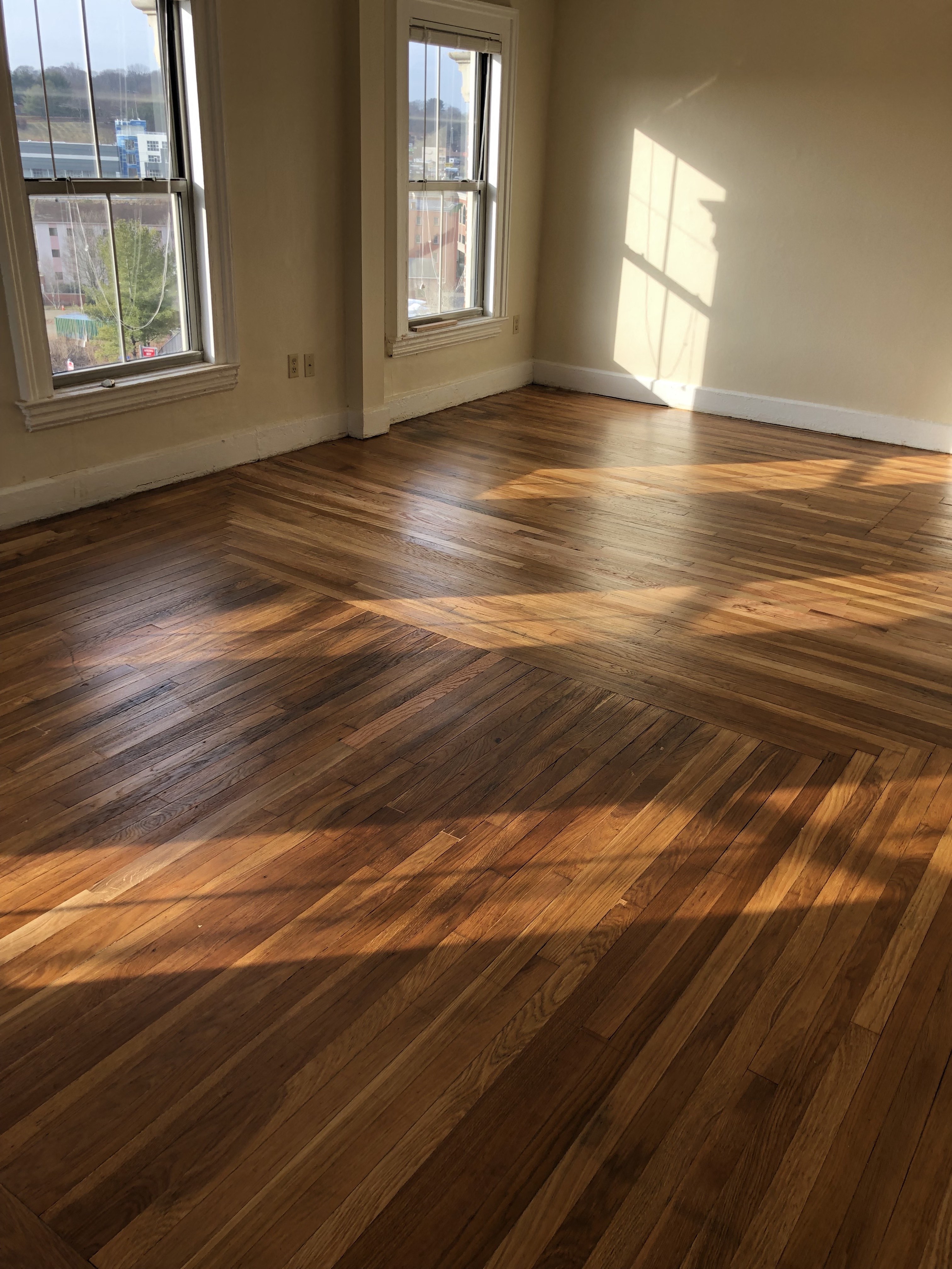 a living room with a hard wood floor