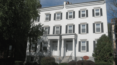a white building with a stop sign in front of it
