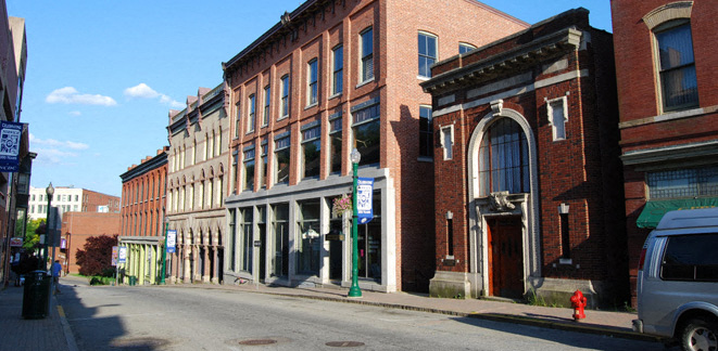 a row of brick buildings on a city street