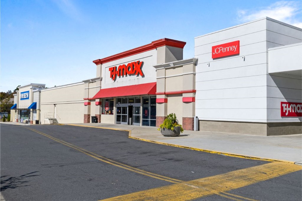 the exterior of a store with a empty parking lot