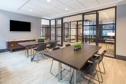 Conference room with glass partitions and modern furniture at 66 Summer Street Apartments, Stamford, 06901