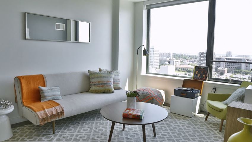 a living room with a couch and a table