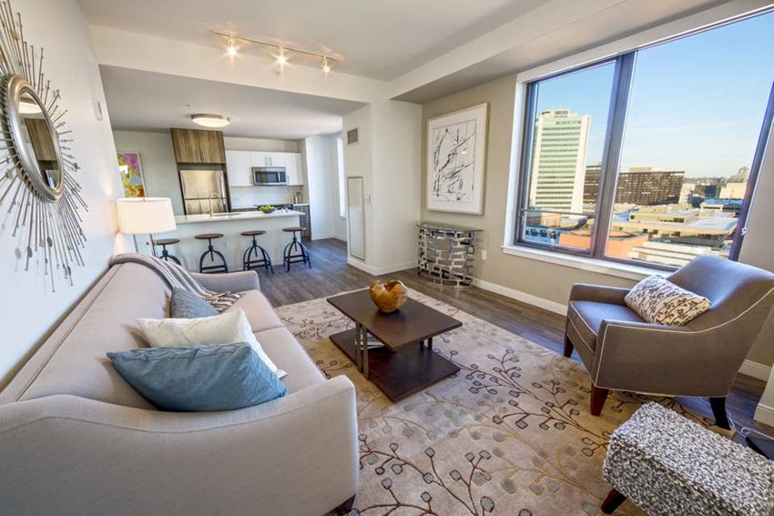 a living room with a large window and a couch