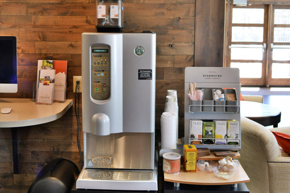 a coffee machine sitting on a table in a room