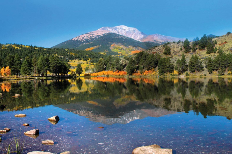 a lake with a mountain in the background