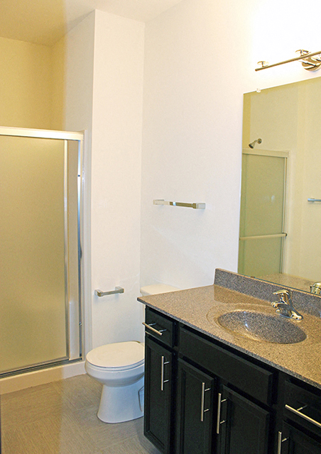 a bathroom with a sink toilet and a shower