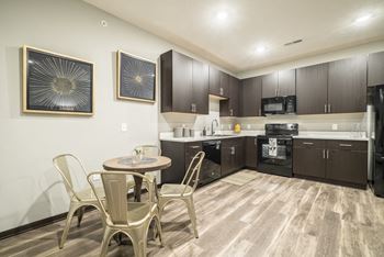 kitchen area with light hardwood style flooring throughout