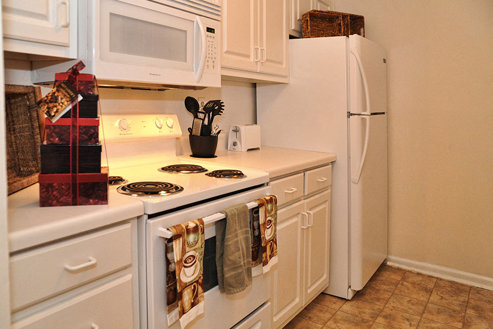 a kitchen with a stove and a refrigerator