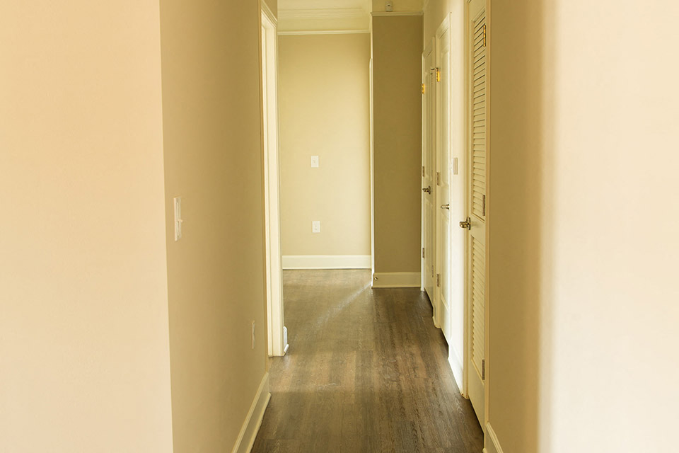 hallway with wood style flooring