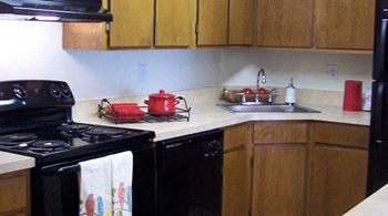 Electric Range In Kitchen at Lake in the Woods, Melbourne, FL