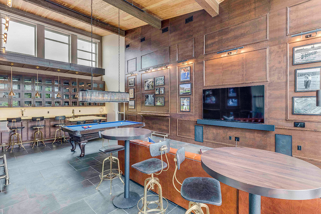 a game room with a pool table and a television