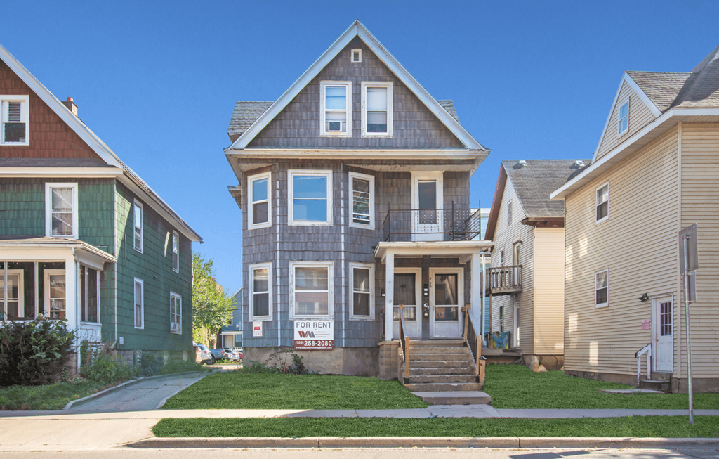 a row of houses on the side of a street