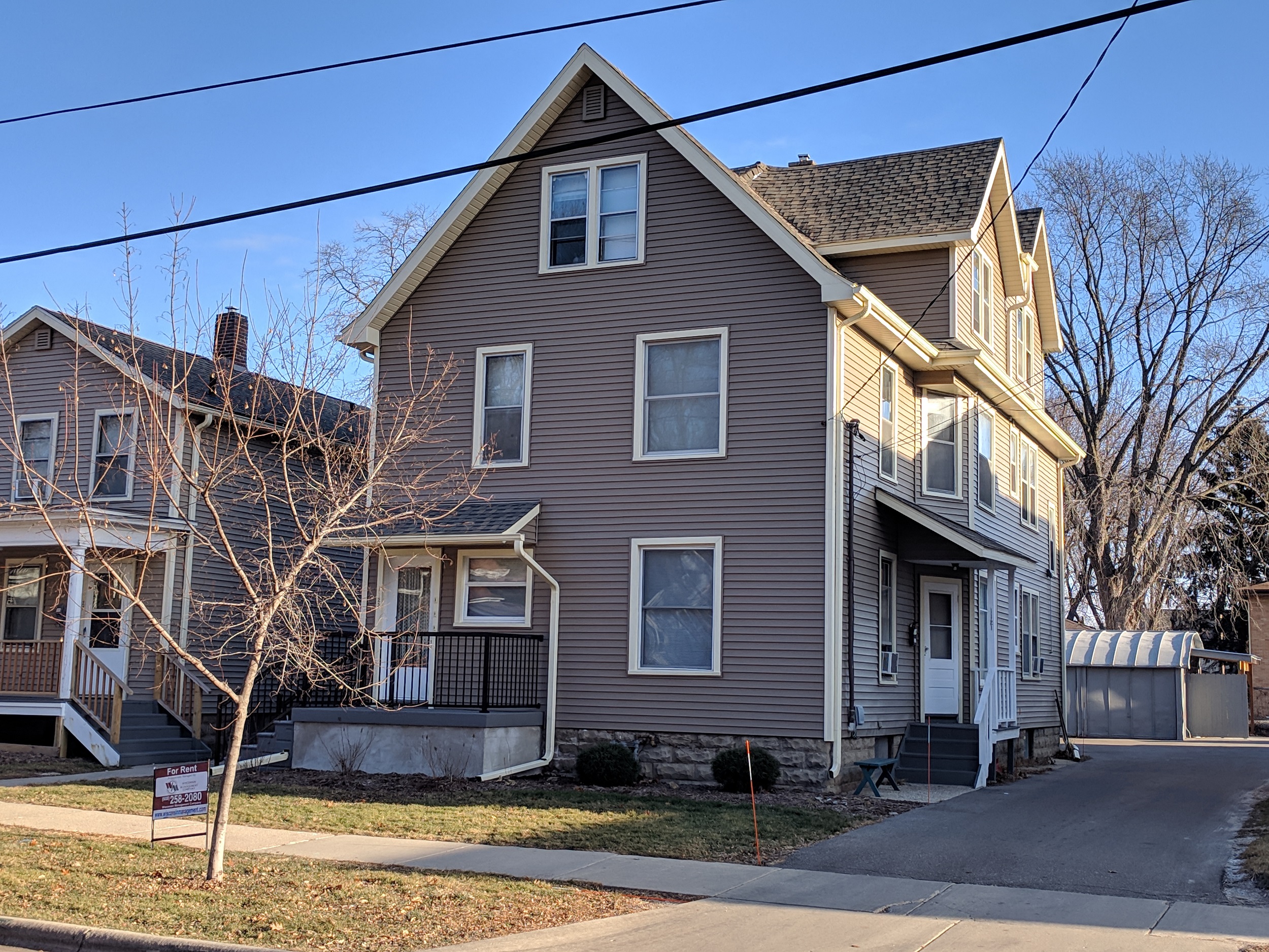 two houses on a street in a neighborhood