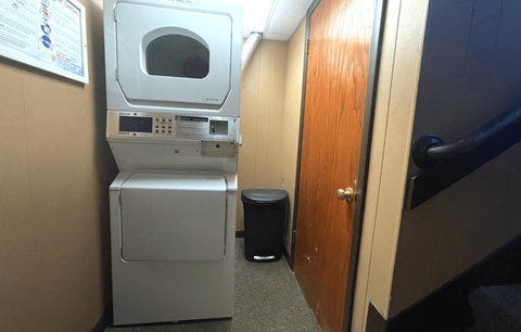 a small laundry room with a washing machine and a dryer