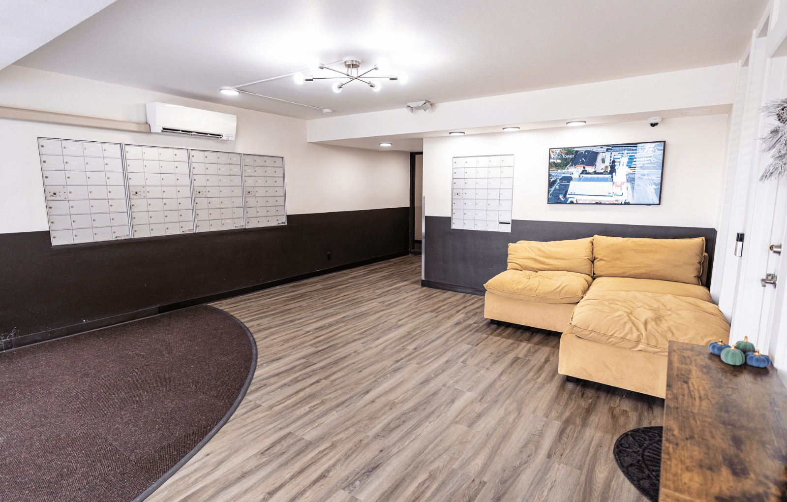 A living room with a couch and a television.