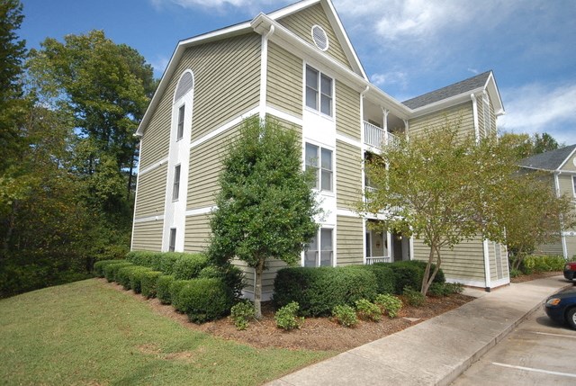 a house with a sidewalk in front of it