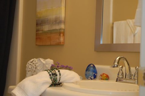 a bathroom sink with a towel on top of it