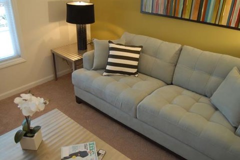 a living room with a couch and a table