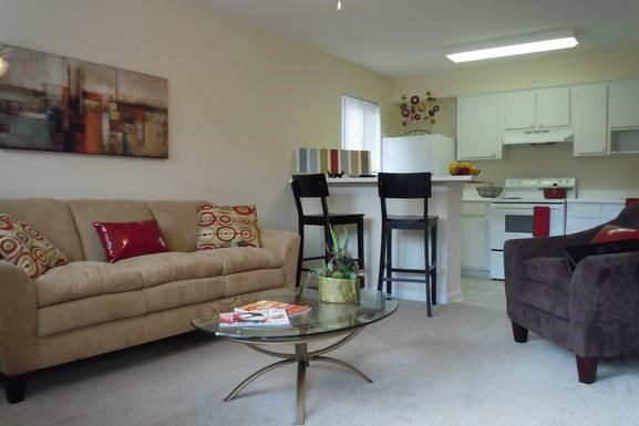 a living room with a couch and a table