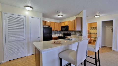 a kitchen with a counter top and a refrigerator