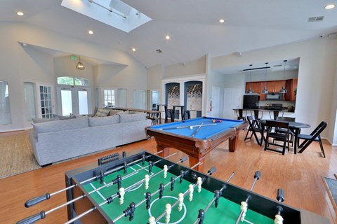 a game room with a pool table and a