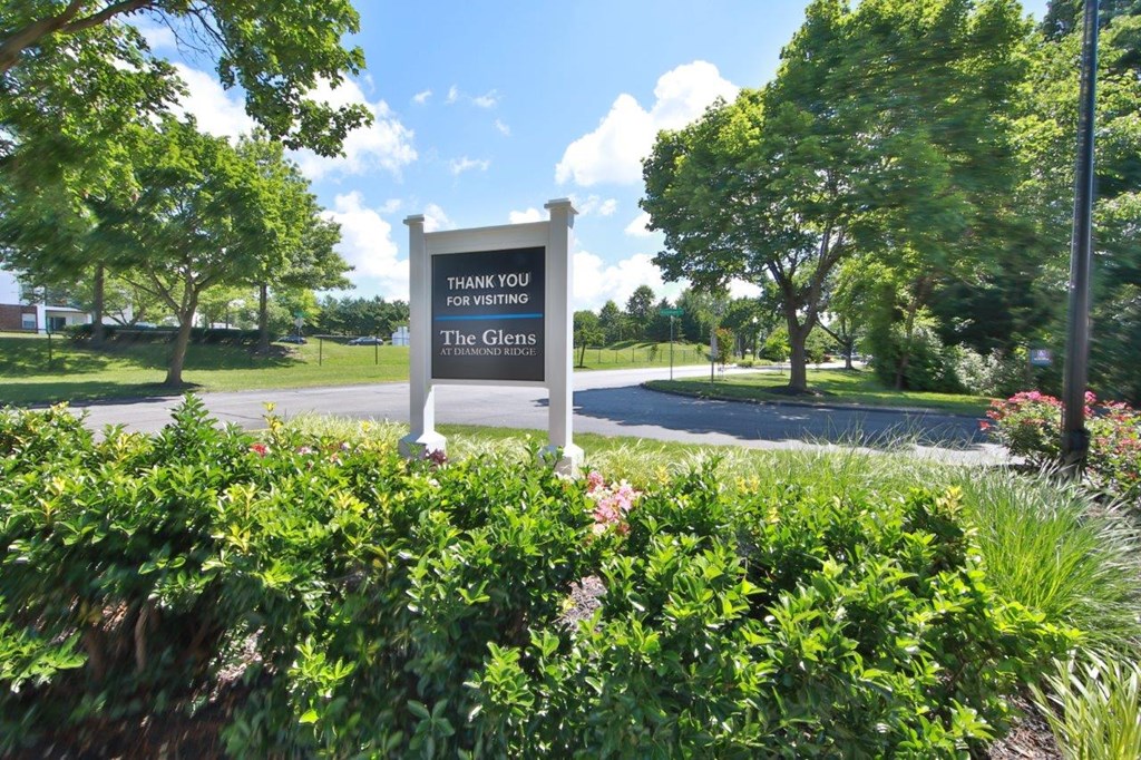 a park with a sign that says thank you for serving the citizens