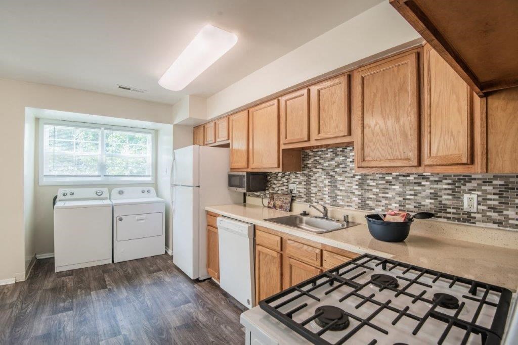 a kitchen with a stove and a sink