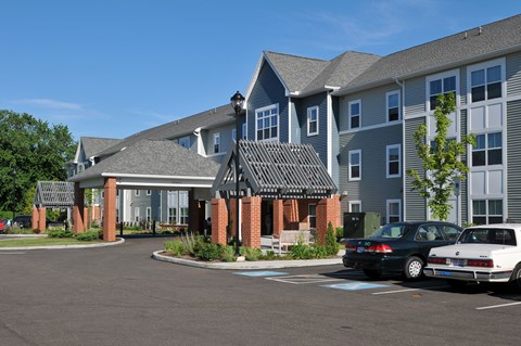 Modern apartment community featuring contemporary architecture, beautifully maintained landscaping, and inviting curb appeal.