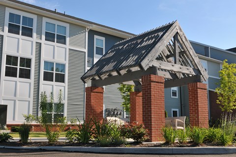 Modern apartment community featuring contemporary architecture, beautifully maintained landscaping, and inviting curb appeal.