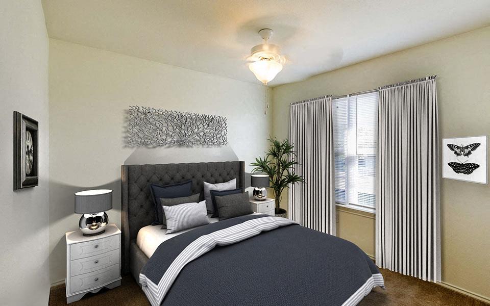 a bedroom with a large bed and a window