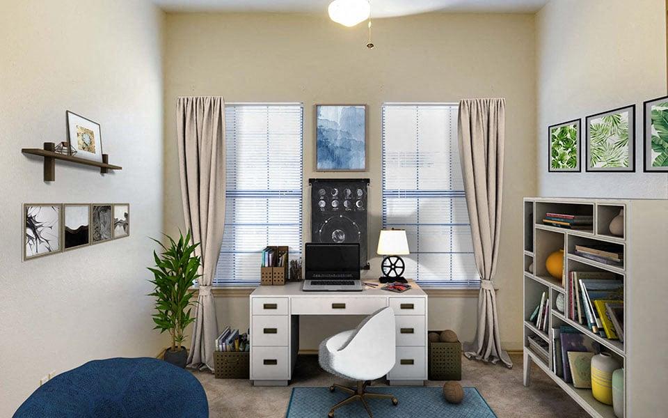 a room with a desk and a laptop on it