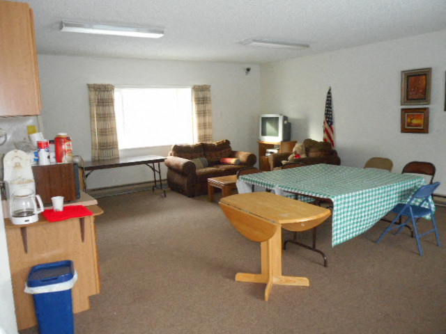 a living room filled with furniture and a table