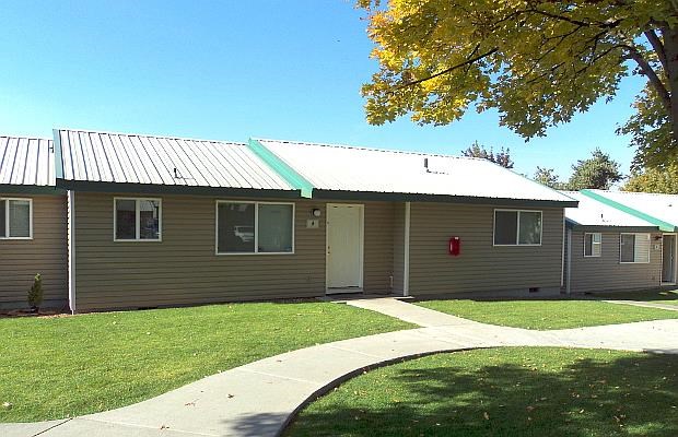 a house with a sidewalk in front of it