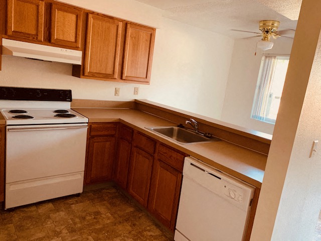 a small kitchen with a stove and a sink