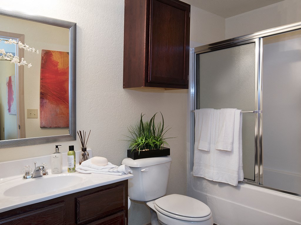our bathrooms at the reserve feature a large mirror and a sink