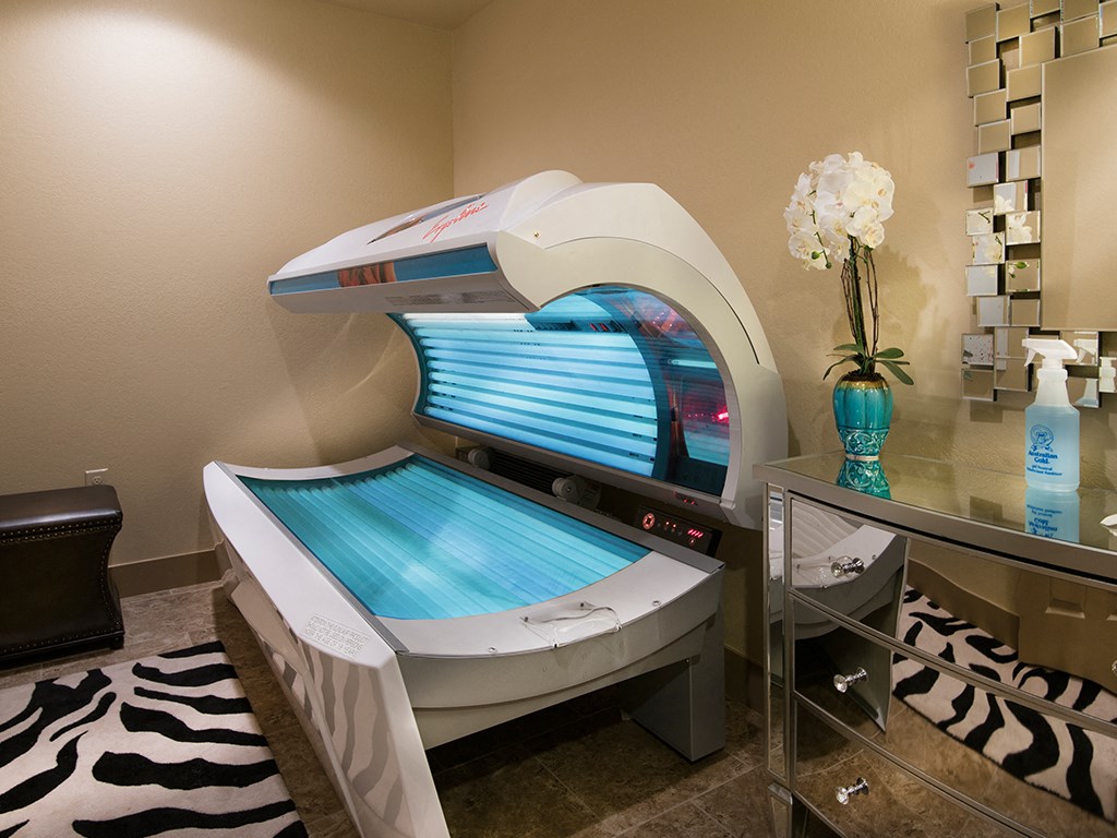 a spa room with two massage beds and a table